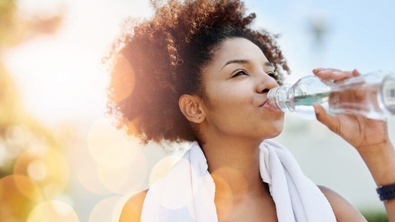 girl drinks water on a drinking diet